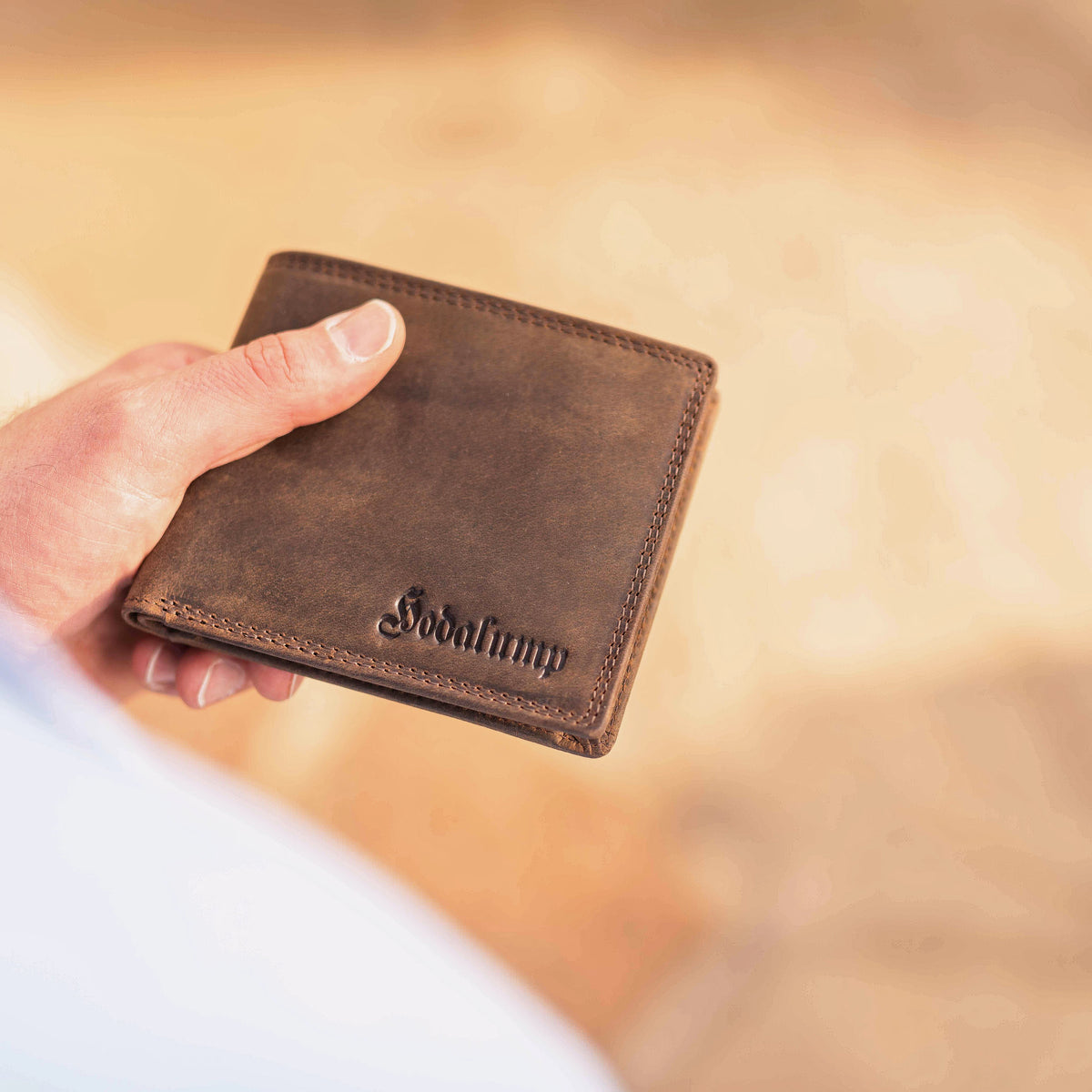 Open leather wallet with several card slots